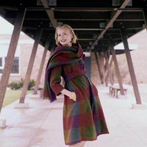 Christa Vogel modeling a plaid coat and scarf in 1958. Image from Flickr.